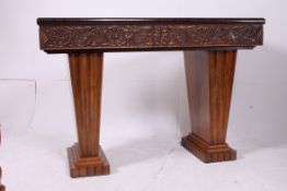 A 1930's Art Deco walnut and black glass