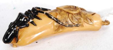 A 20th century Japanese tagua nut carvin