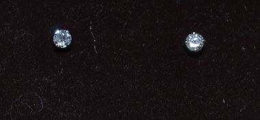 A pair of white gold diamond stud earrin