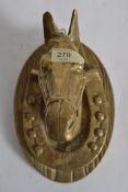 A 20th century brass horses head, wall m