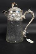 A cut glass and silver plated claret jug