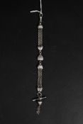A white metal and silver watch chain wit