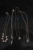 A collection of silver ladies necklaces