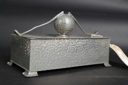 An early 20th century hammered pewter ta