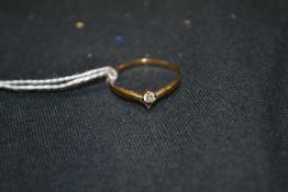 A 9ct gold ladies diamond solitaire ring