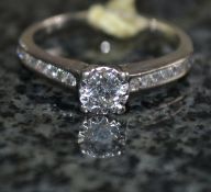 A 9ct white gold and diamond ring, 25ct