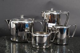 A retro Old Hall stainless steel service