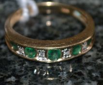 A 9ct gold emerald and diamond ring, wit
