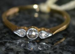 An 18ct gold and platinum three stone an