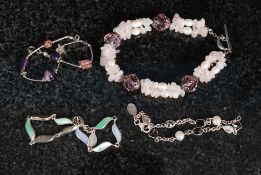 A collection of silver  bracelets of mod