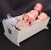 A pair of vintage dolls within a scratch