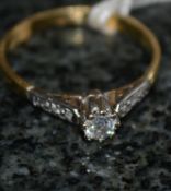An 18ct gold and single stone diamond ri