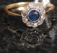 An 18ct white gold and diamond daisy hea