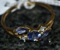 A 9ct gold ladies ring with three blue s