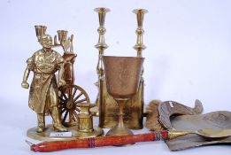 An assortment of brass to include tea ca