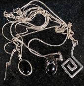 A collection of silver ladies necklaces