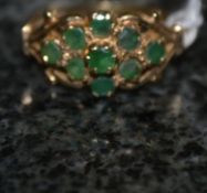 A 9ct gold ladies ring with inset green