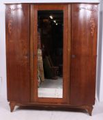 A 1930's Art Deco triple wardrobe. Raise