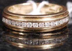 An 18ct gold and diamond channel set hal