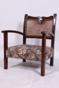 A 1930's tapestry and mahogany upholster