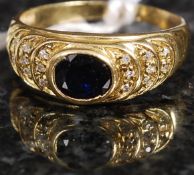 A yellow gold and sapphire and diamond r