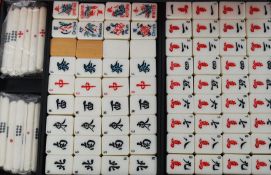 A complete (and partly unopened) set of bamboo and bone Mah Jongg tiles and counters.