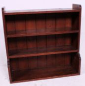 A 20th century pine open window shabby chic bookshelf / bookcase with stage gallery top.