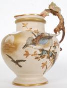 A 20th century Austrian Ivory Blush  jug  / ewer with adorned dragon handle and hand painted bird