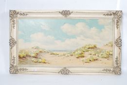 A framed oil on canvas of a coastal dune scene being signed left hand bottom  corner De - Nooyer