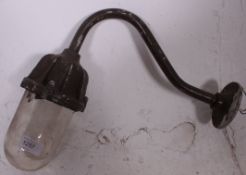 A vintage mid 20th century Industrial dairy light having clear glass shade being complete with the