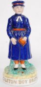 A 19th Century Staffordshire pottery figure with notation to the plinth  'Colston Boy' Bristol