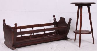 A vintage 20th century wooden childs crib / ideal for dolls. together with an oak side table.