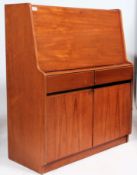 A retro teak wood bureau having a fully lined interior along with a similar bookcase