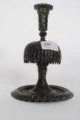 An Ottoman tinned  brass  / bronze ? candlestick having terraced base with raised sconce
