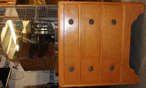 A 1930's Heals style golden oak dressing chest of drawers. The mirror over drawers beneath.