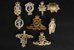 A collection of military and police cap badges to include varying regiments