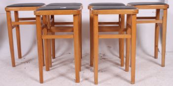 A good set of 6 1960's beech wood and faux black leather kitchen stools having upper peripheral
