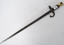 A believed 19th century tri fullered Bayonet with brass hilt to the handle.