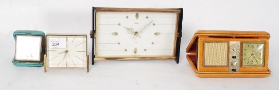 A collection of 4x clocks to include vintage Estyma Radiolarm travel clock, an Oris,