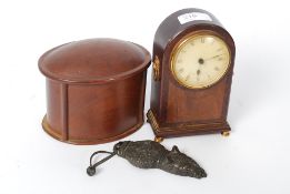 A vintage Comitti of London wooden cases mantel clock together with a cigarette case with lined