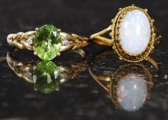 A 9ct opal ring and a 9ct gold pendant. Measures: 4.8g size M and T.