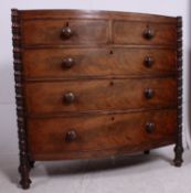 An early 19th century Regency / Georgian flame mahogany Scottish bow front chest of drawers raised