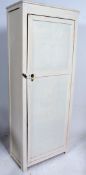 A mid 20th century painted school cupboard having full length panelled door with shelved interior.