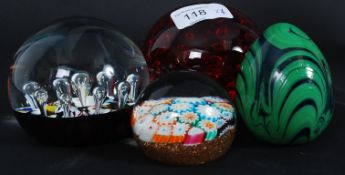 A 20th century millefiori canework paperweight together with 2 control bubble paperweights one