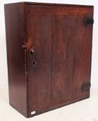 A 19th century Industrial country oak school cupboard.