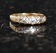 An 18ct gold diamond ring. 50pts. Measures: 2.6g size L.