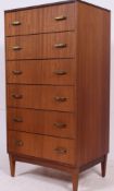 A 20th century retro teak upright pedestal chest of drawers raised on tapered supports with gilt