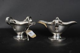 A pair of good quality Beresford silver plate twin sided creamers of lozenge form with hoop handles