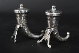 A pair of 20th century silver horn shaped condiments - salt & pepper pots bearing Norwegian