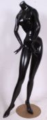 A vintage painted 1950's shop display haberdashery mannequin standing on chrome base.
